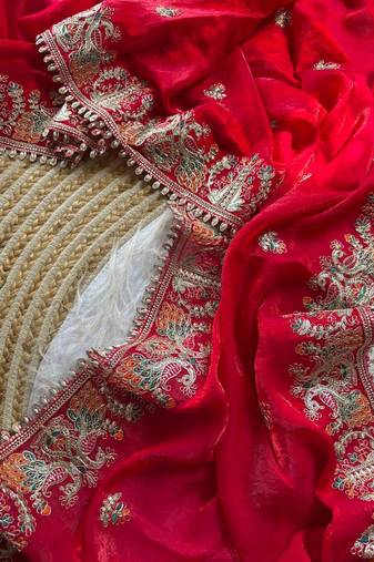 red satin silk saree with heavy embroidery and butti motifs