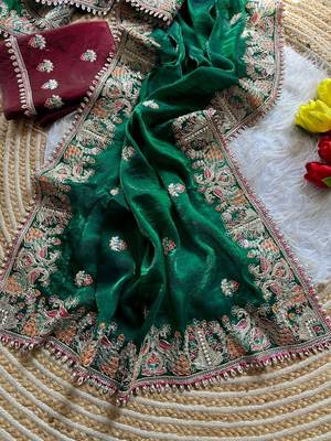 green satin silk saree with floral embroidery and tassels 1