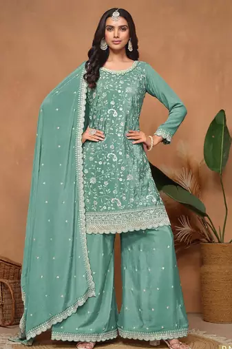 Turquoise chinnon embroidery & sequins semi stitched suit size up to 42
