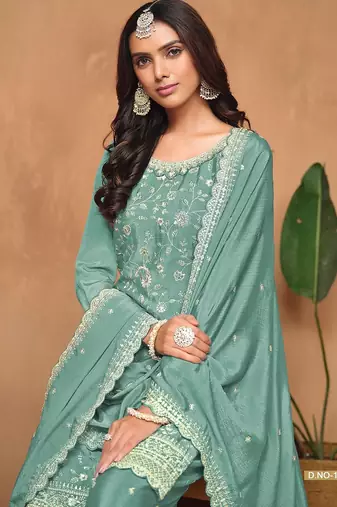 Turquoise chinnon embroidery & sequins semi stitched suit size up to 42