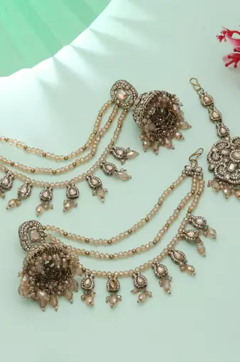 gold kundan jhumka earrings with tikka bridal set
