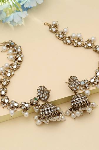 white kundan jhumka earrings with pearl drops