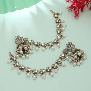 white kundan jhumka earrings with pearl drops 2