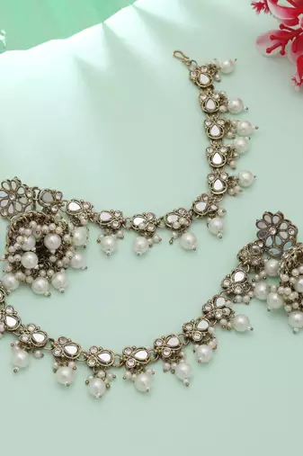 white kundan jhumka earrings with pearl drops