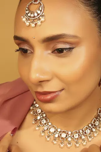 Round & oval shape white kundan stone gold plated brass choker necklace set with maang tikkka for women
