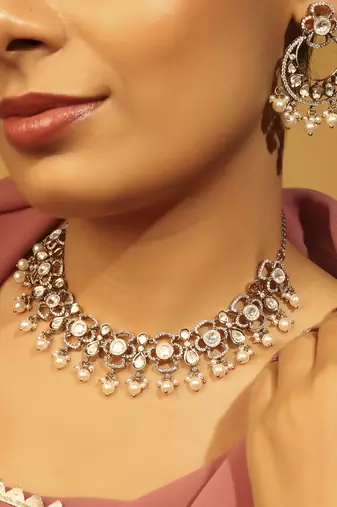 Round & oval shape white kundan stone gold plated brass choker necklace set with maang tikkka for women