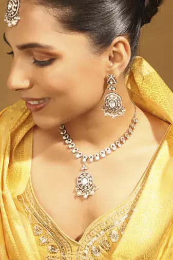 white brass choker necklace with round kundan work