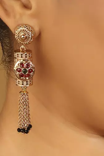 gold tone temple style long mangalsutra set with flower motifs