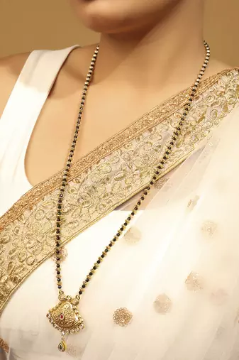 gold tone long mangalsutra with black beads & oval pendant