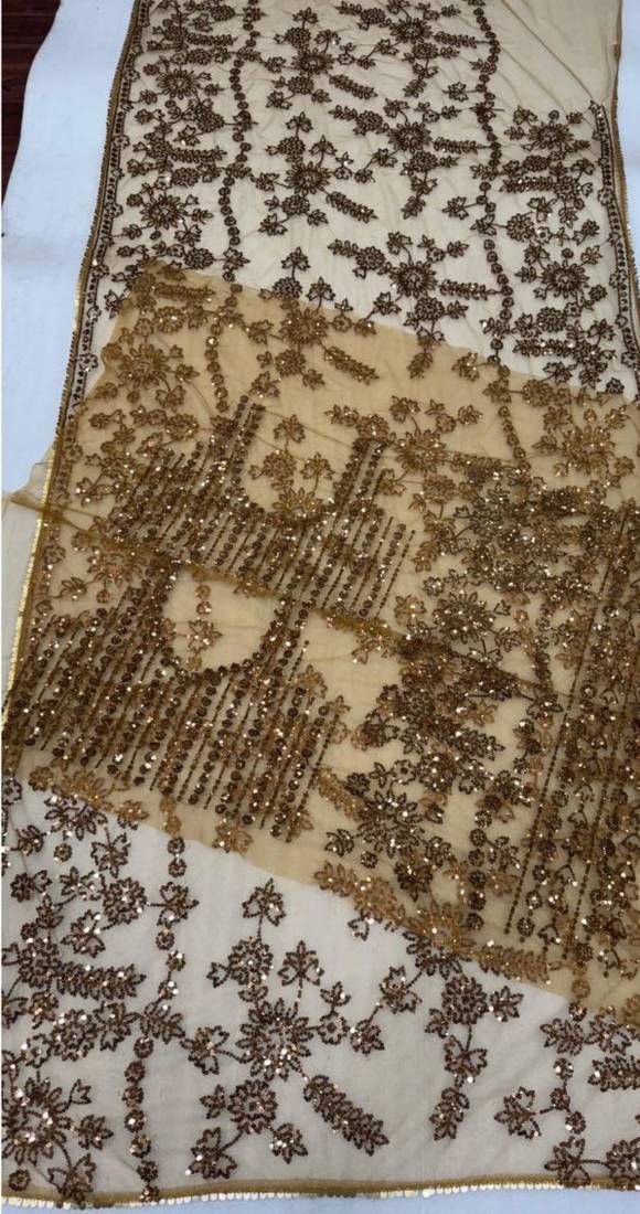 golden net saree with sequins embroidery work