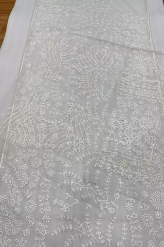 off white net saree with sequins embroidery work