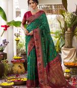 Dark green silk woven saree with blouse