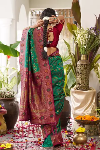 Dark green silk woven saree with blouse