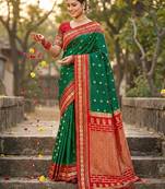 Dark green silk woven saree with blouse