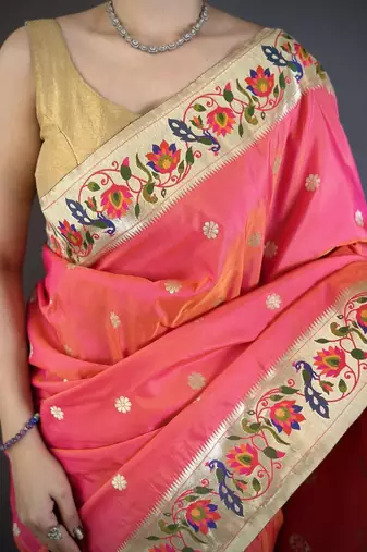 Orange color zari woven paithani silk blend saree with blouse
