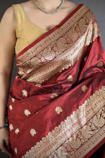 Maroon color zari woven banarasi silk blend saree with blouse