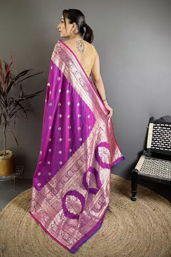 Magenta color zari woven banarasi silk blend saree with blouse