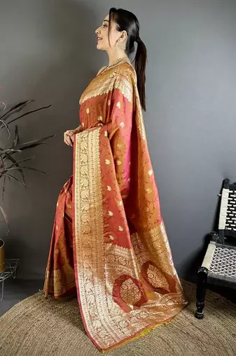 Peach color zari woven banarasi silk blend saree with blouse