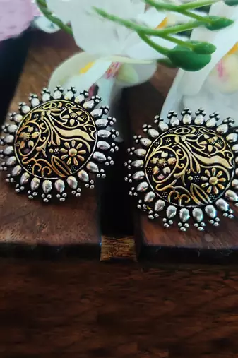 Dual-tone circular stud earrings