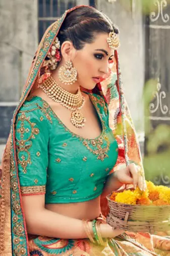 Pure silk party wear saree in peach color with embroidery work