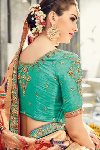 Pure silk party wear saree in peach color with embroidery work