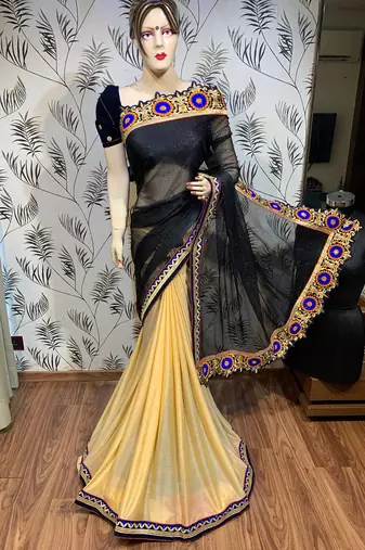 Fancy fabric party wear saree in black with embroidery work & crystal stone work