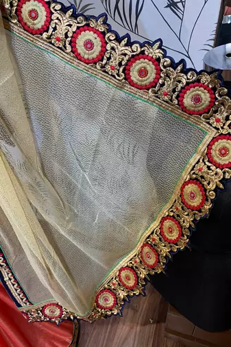 Fancy fabric party wear saree in cream with embroidery work & crystal stone work