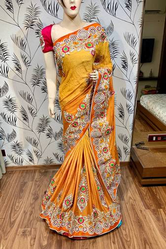 Fancy fabric party wear saree in mustard with embroidery work & crystal stone work