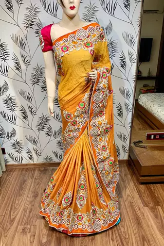 Fancy fabric party wear saree in mustard with embroidery work & crystal stone work