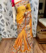 Fancy fabric party wear saree in mustard with embroidery work & crystal stone work