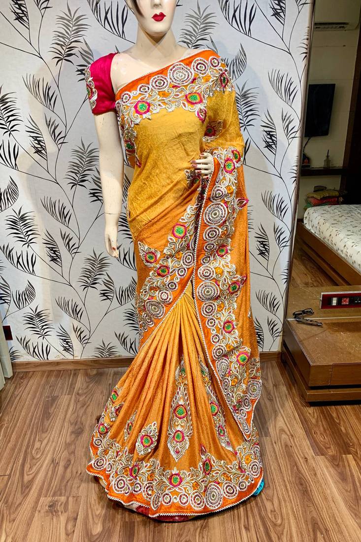 Fancy fabric party wear saree in mustard with embroidery work & crystal stone work