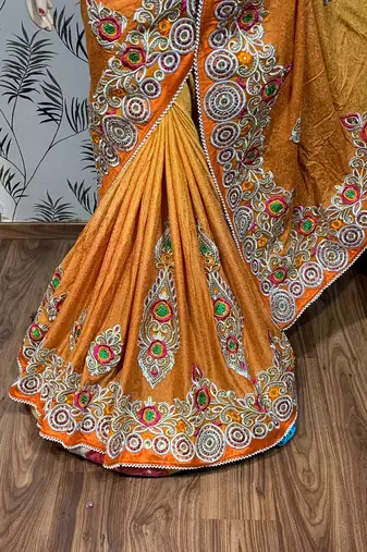Fancy fabric party wear saree in mustard with embroidery work & crystal stone work