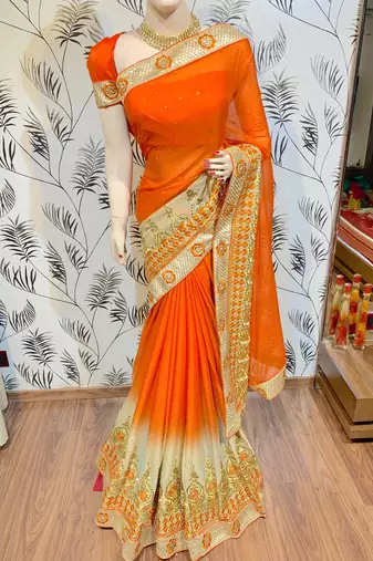 Chinon chiffon wedding wear saree in orange with embroidery work & crystal stone work