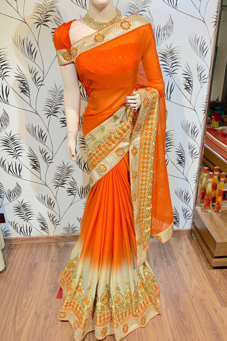 Chinon chiffon wedding wear saree in orange with embroidery work & crystal stone work