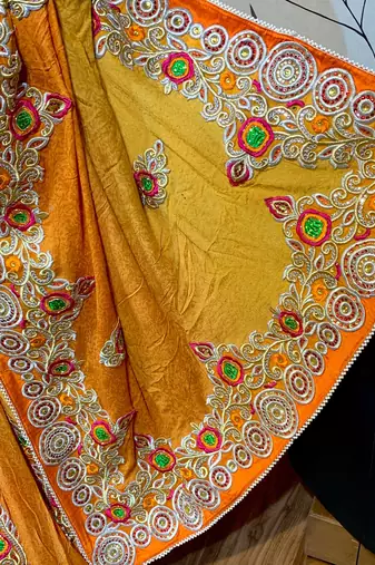 Fancy fabric party wear saree in mustard with embroidery work & crystal stone work