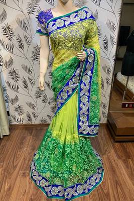 Soft premium net party wear saree in green with embroidery work & crystal stone work 1