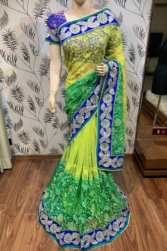 Soft premium net party wear saree in green with embroidery work & crystal stone work