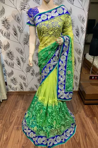 Soft premium net party wear saree in green with embroidery work & crystal stone work