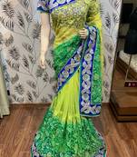 Soft premium net party wear saree in green with embroidery work & crystal stone work
