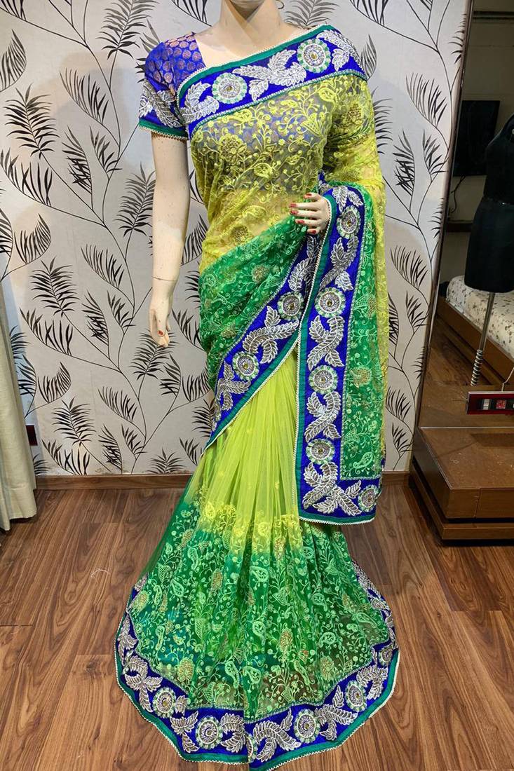 Soft premium net party wear saree in green with embroidery work & crystal stone work