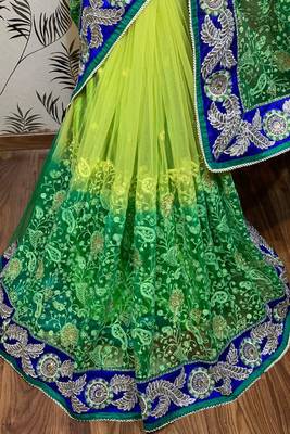 Soft premium net party wear saree in green with embroidery work & crystal stone work 2