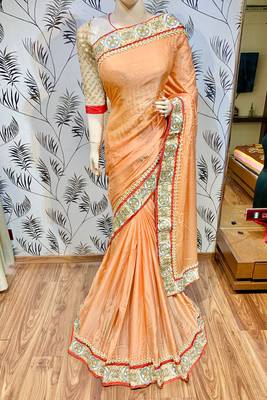 Fancy fabric party wear saree in peach with embroidery work & crystal stone work 1