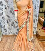 Fancy fabric party wear saree in peach with embroidery work & crystal stone work