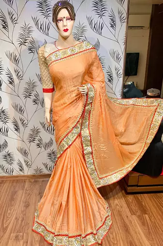 Fancy fabric party wear saree in peach with embroidery work & crystal stone work