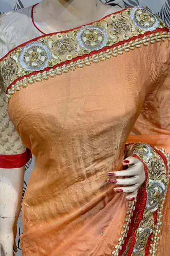 Fancy fabric party wear saree in peach with embroidery work & crystal stone work
