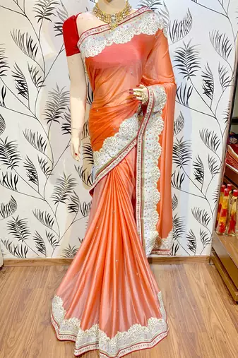 Fancy fabric silk party wear saree in peach with embroidery work & crystal stone work