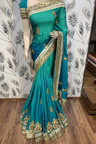 Pure shadow silk party wear saree in green with embroidery work & crystal stone work