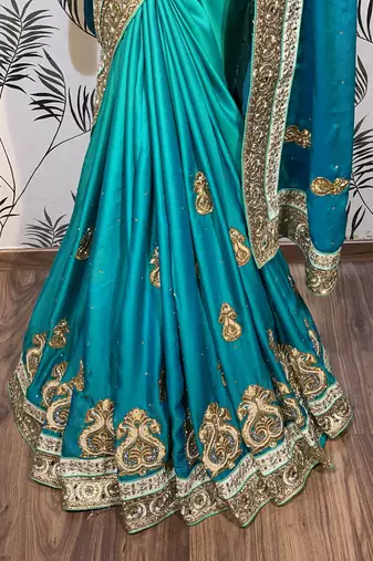 Pure shadow silk party wear saree in green with embroidery work & crystal stone work