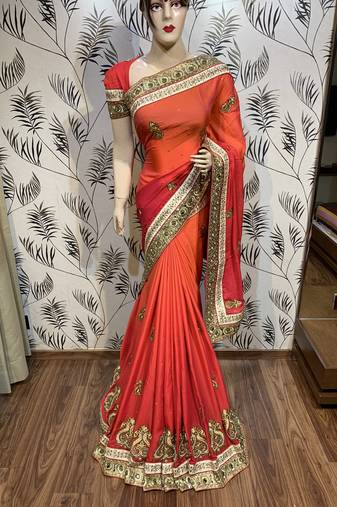 Pure shadow silk party wear saree in orange with embroidery work & crystal stone work