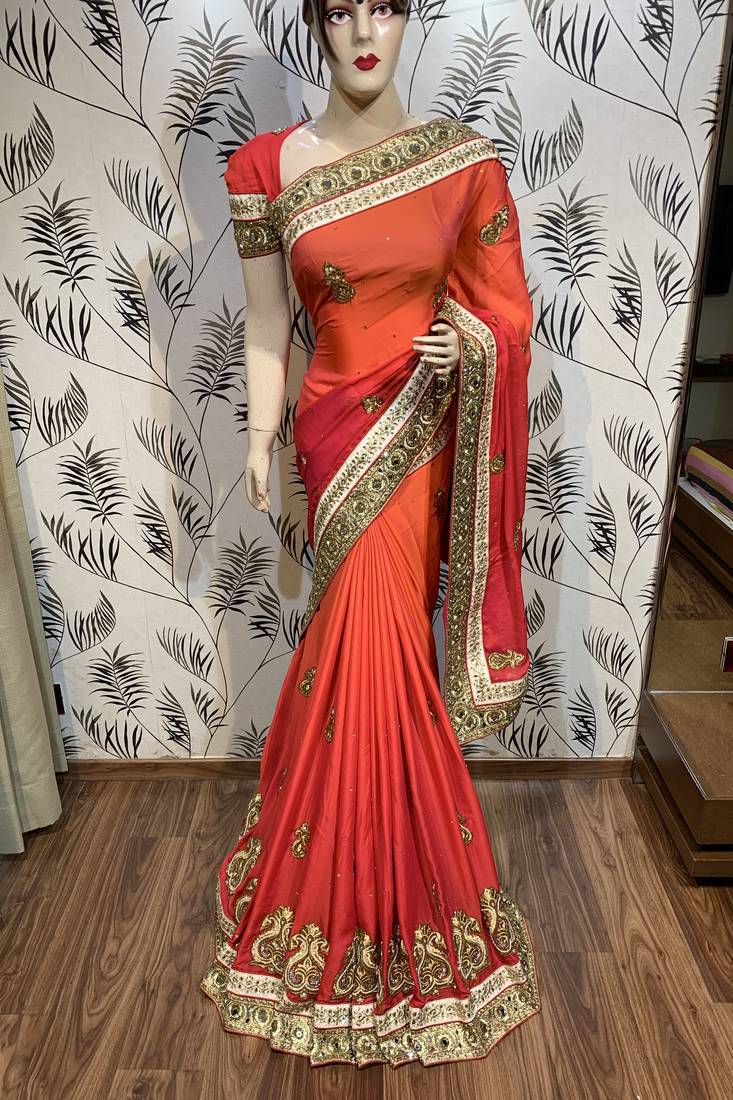 Pure shadow silk party wear saree in orange with embroidery work & crystal stone work